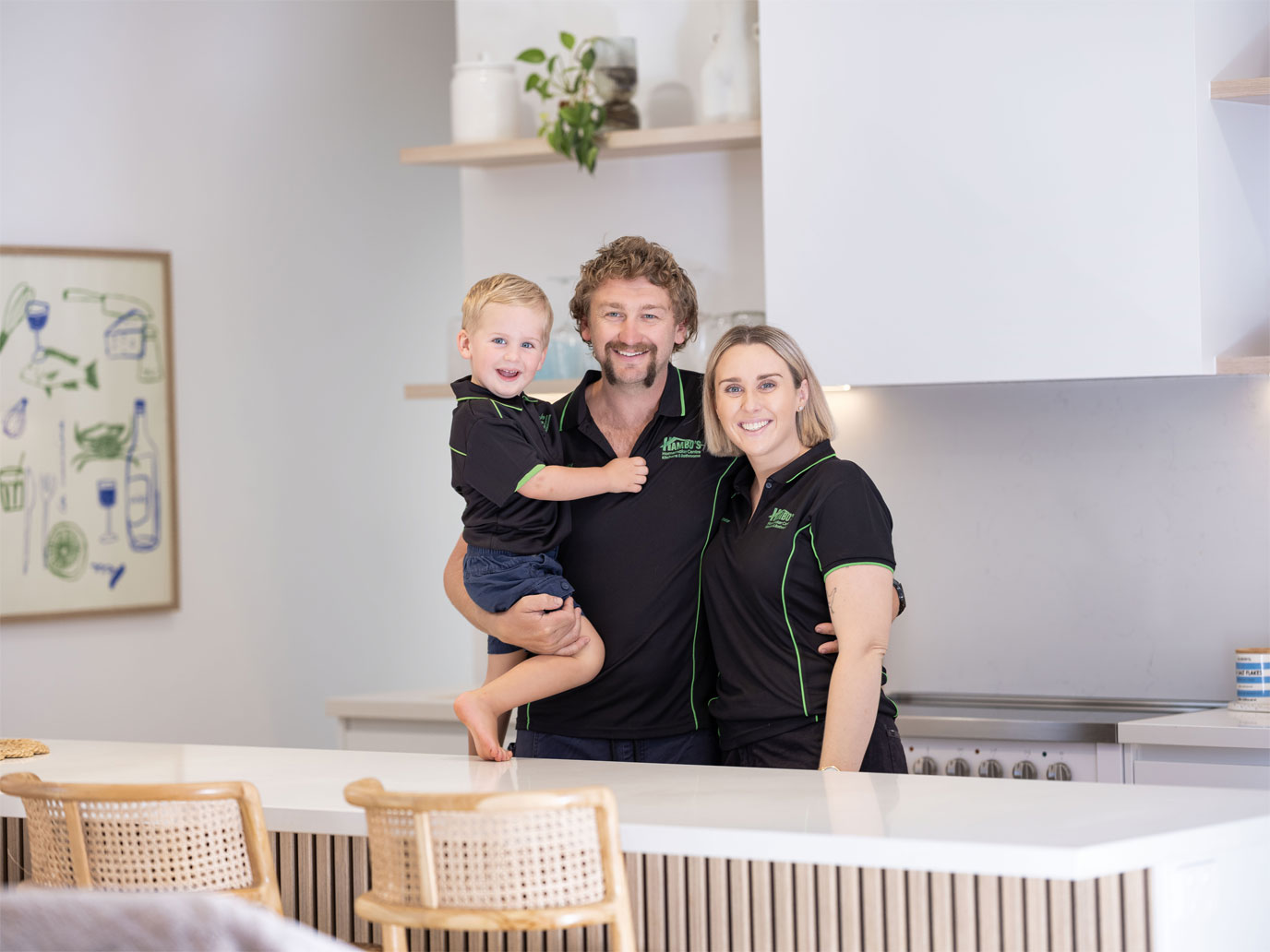 The family behind Hambo's Homemaker Centre — Jess, Locky, and Ollie in the showroom kitchen